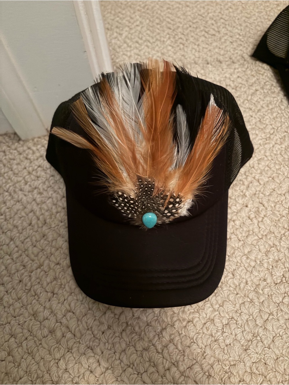 Black Feathered Trucker Hat with Turquoise Accent
